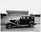 1932 Packard sedan, parked in front of a reproduction of the Parthenon