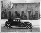 1933 Packard club sedan, right side view, parked on street in front of house