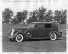 1936 Packard formal sedan, nine-tenths left side view, parked on grass