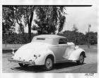 1936 Packard convertible coupe, top raised, parked on street