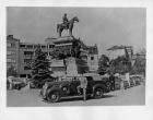1936 Packard convertible sedan, parked on street in front of 'King Liberator's' monument