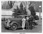 1936 Packard touring sedan, couple standing at driver's door