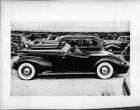 1938 Packard convertible victoria, left side view, top folded, Alvin Macauley, Jr. behind wheel