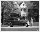1938 Packard touring sedan, right side view, parked in driveway of Alvan Macauley