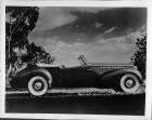 1939 Packard convertible victoria, right side view, top folded, parked in grass