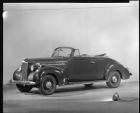 1940 Packard convertible coupe, nine-tenths left side view, top folded