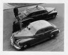 1946 Packard touring sedans, parked on street