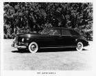 1947 Packard sedan, nine-tenths left side view, parked on grass