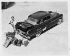 1951 Packard 400 Patrician, rear aerial view, female standing at trunk with luggage