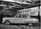 1951 Packard sedan, left side view, parked inside a garage