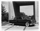 1952 Packard 300 sedan parked under arch