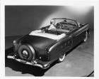 1952 Packard 200 convertible, three-quarter rear view, top folded, female behind wheel