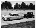 1954 Packard club sedan pulling a jeep at Packard Proving Grounds