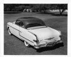 1954 Packard sedan, three-quarter rear right view, parked on grass