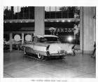 1956 Packard custom Clipper, three-quarter rear view, on display in showroom
