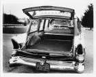1957 Packard station wagon, female behind wheel looking over her shoulder