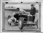 1928 Packard race car being checked on track